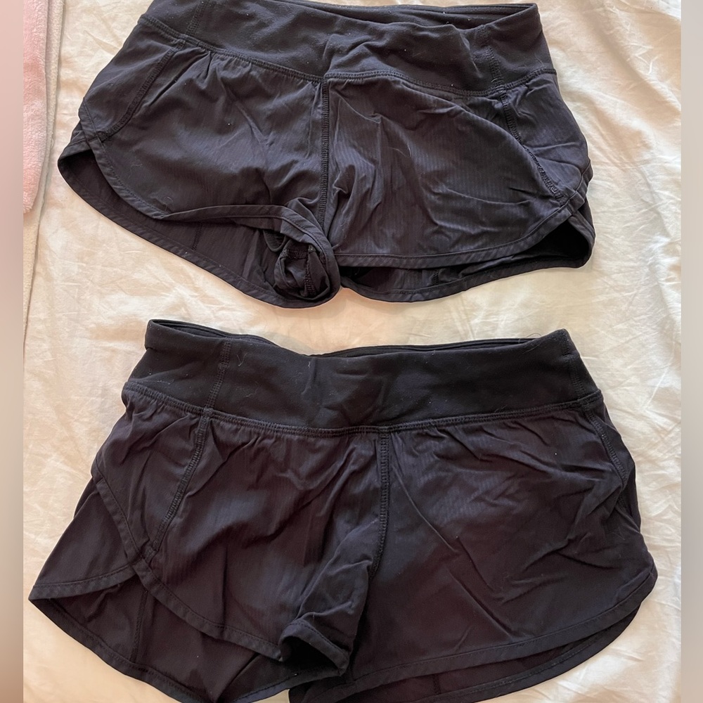 Two pairs of black shorts
